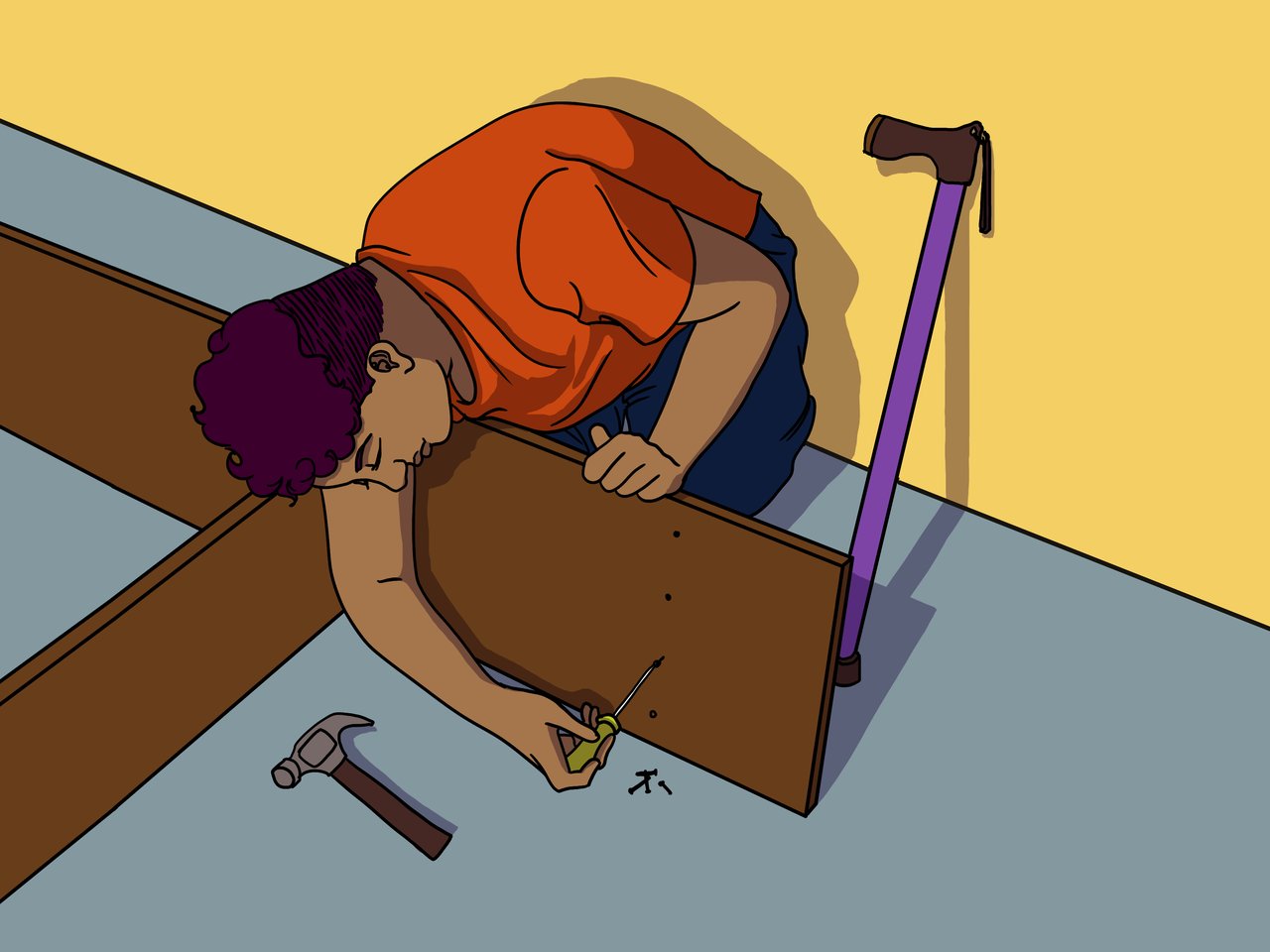 A woman kneels on the floor using a yellow screwdriver to assemble a bookcase