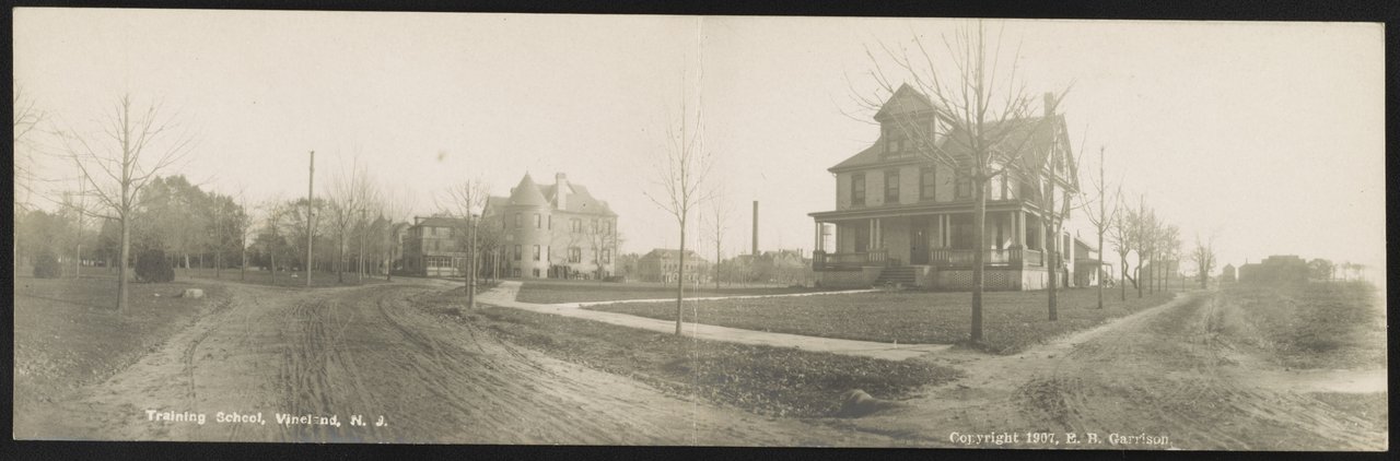 A 1907 panoramic postcard of dirt roads and buildings at the Training School in Vineland, New Jersey