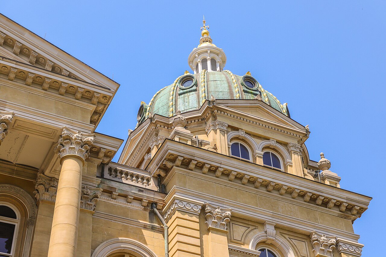 The gold dome of the Iowa State Capitol in Des Moines