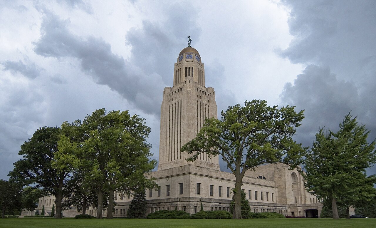 The Nebraska State Capitol in Lincoln under storm clouds