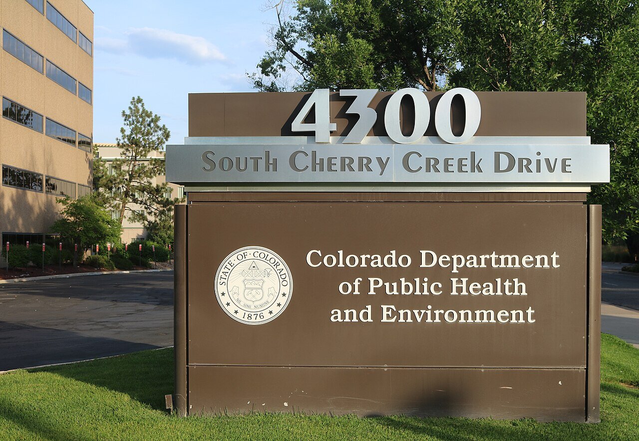 The sign outside the Colorado Department of Public Health and Environment headquarters on South Cherry Creek Drive